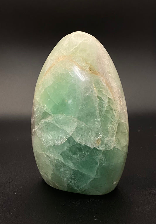 Fluorite crystal stone on a black background