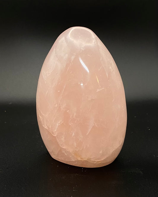 Rose Quartz crystal on a black background