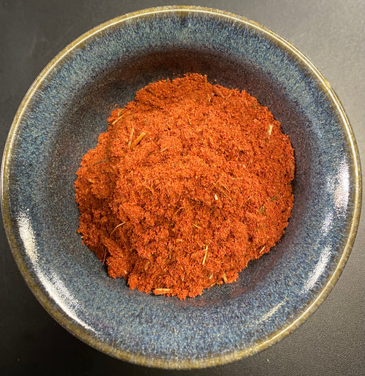 Fire Incense orange powder with herbal bits in