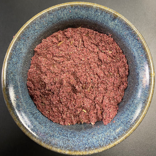 Reversing Incense dark pink powder with herbal bits in