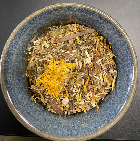 Detox Tea yellow brown and green herbal mix with yellow flowers