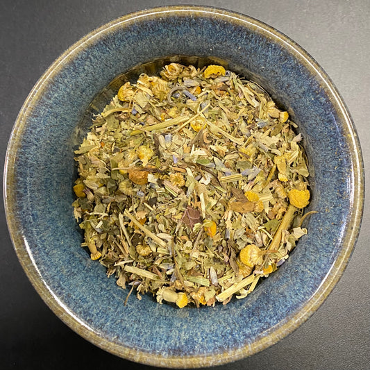 Restful Sleep Tea yellows, tans, and greenish bits in a n herbal mixture.