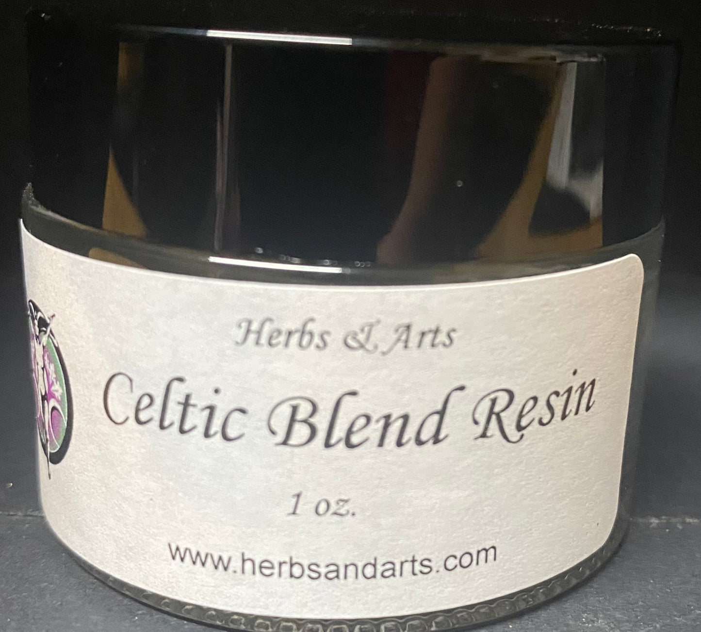 Jar of Celtic Blend Resin with a label on a dark background