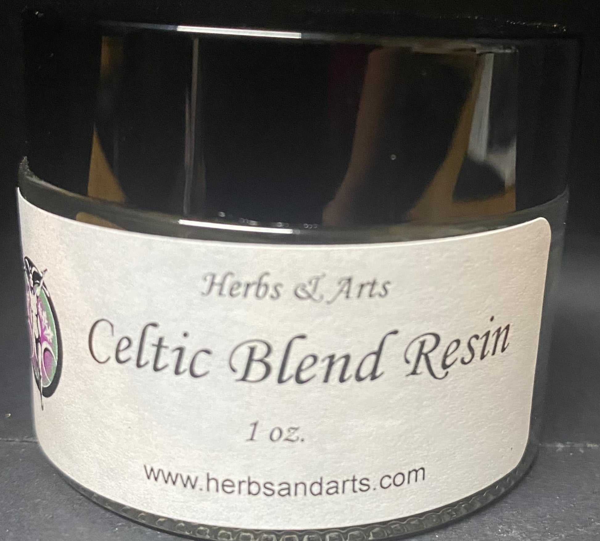Jar of Celtic Blend Resin with a label on a dark background