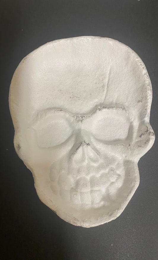 Skull-shaped object on a dark background