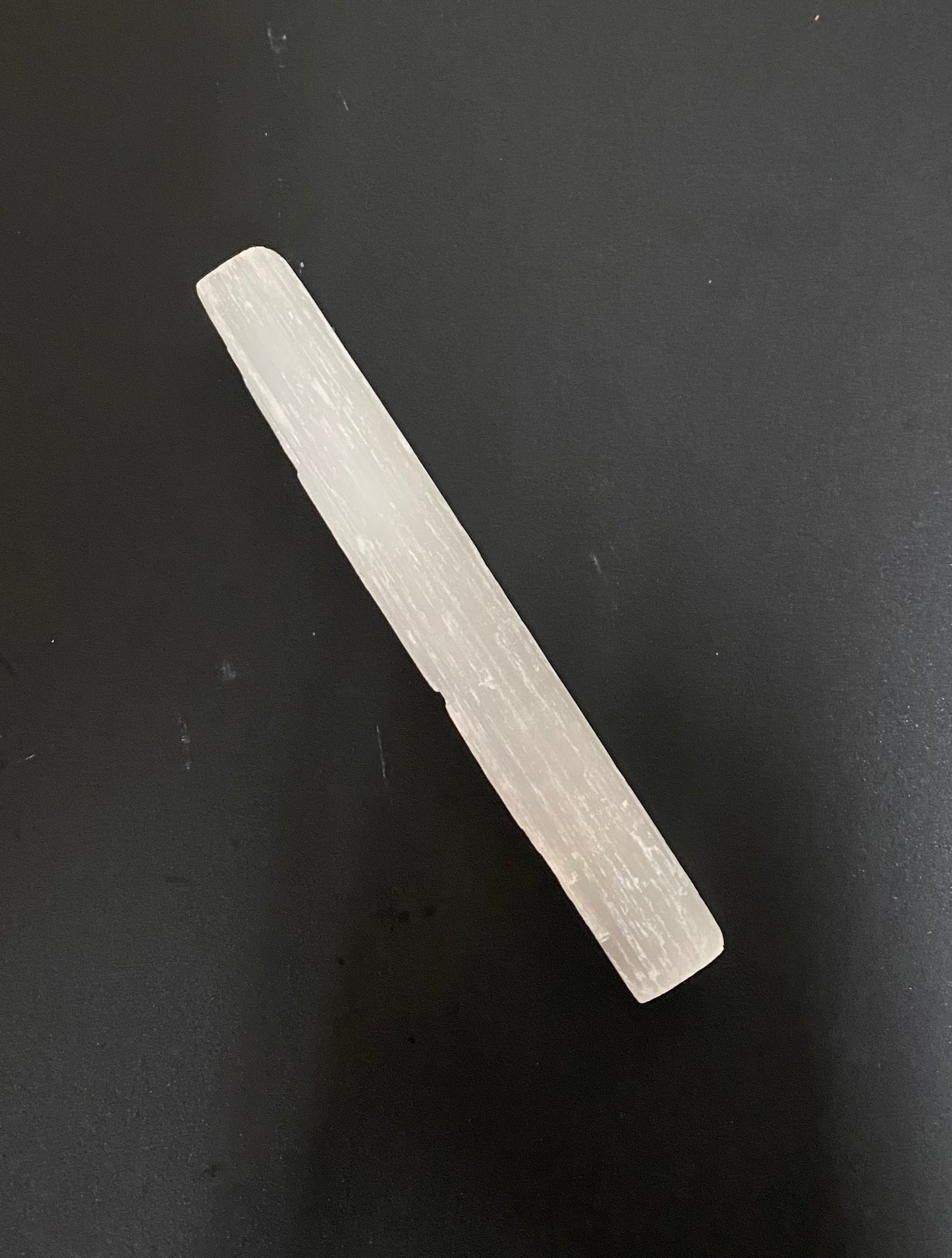 Rectangular crystal on a black background