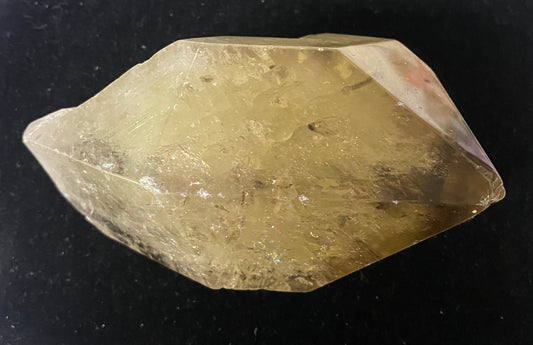 Crystal or mineral specimen on a black background