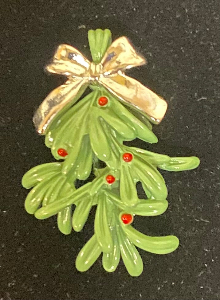 Charm/Pendant Mistletoe with a silver bow on a black background
