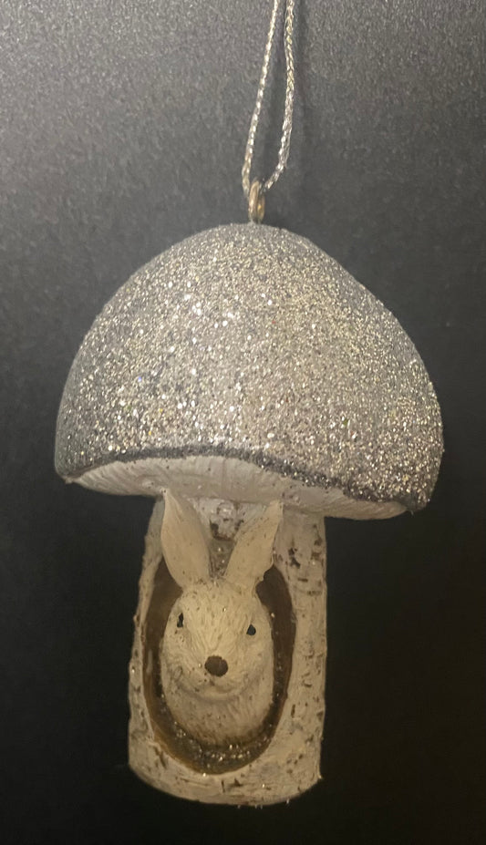 Decorative ornament with a rabbit inside a mushroom on a black background