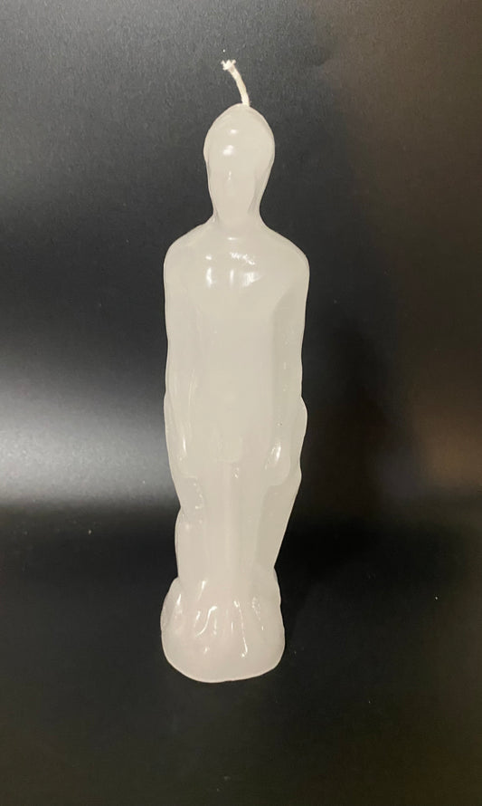 White candle shaped like a person on a black background
