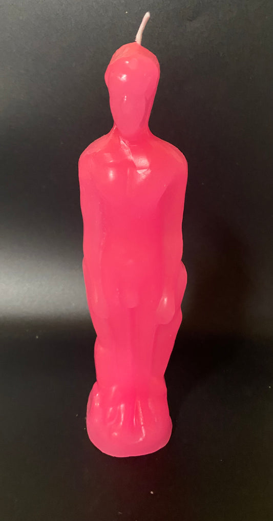 Pink candle shaped like a person on a black background