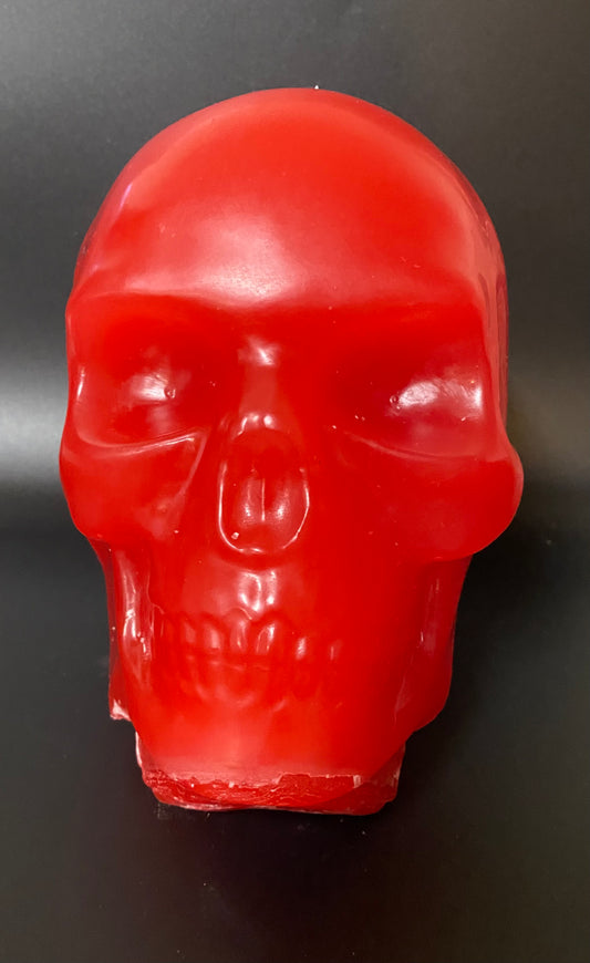 Red skull-shaped object on a dark background