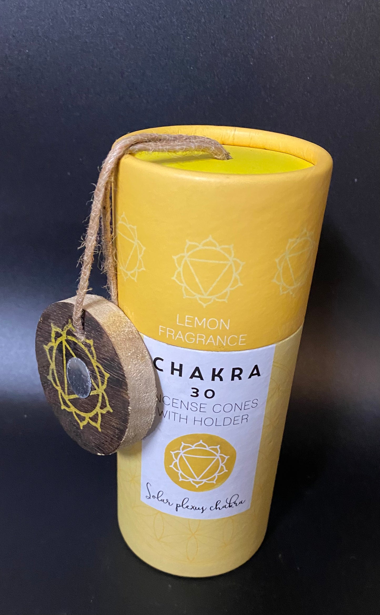 Yellow cylindrical container with 'Chakra' branding on a black background