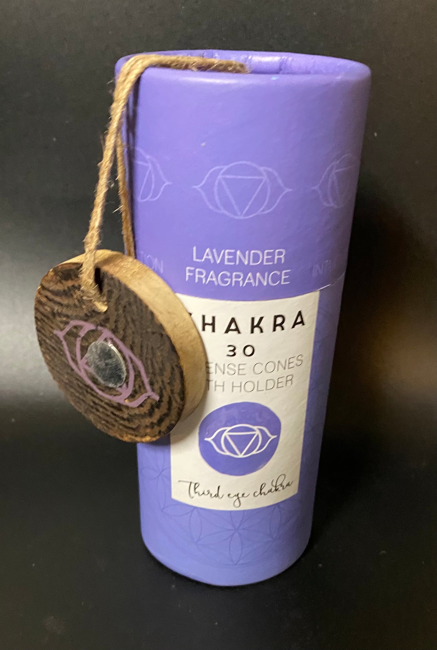 Purple container with a wooden tag labeled 'Lavender Fragrance Chakra 30' on a dark background