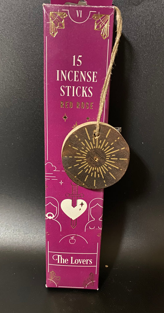 Purple box of incense sticks with a decorative label on a black background