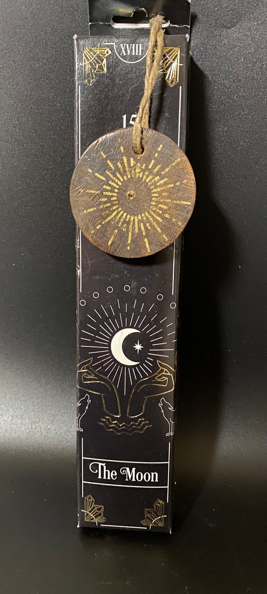 Decorative item with 'The Moon' design on a black background