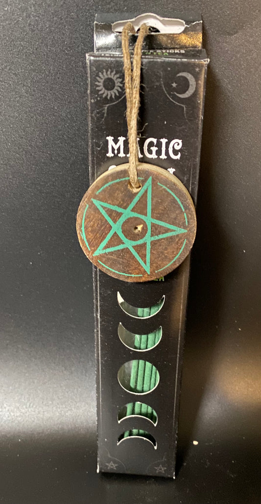Decorative pendant with pentagram design on a black box labeled 'Magic'.