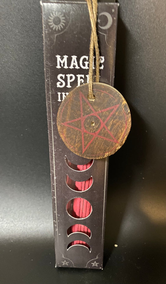 Decorative item with pentagram design on a black box labeled 'Magic Spells'.