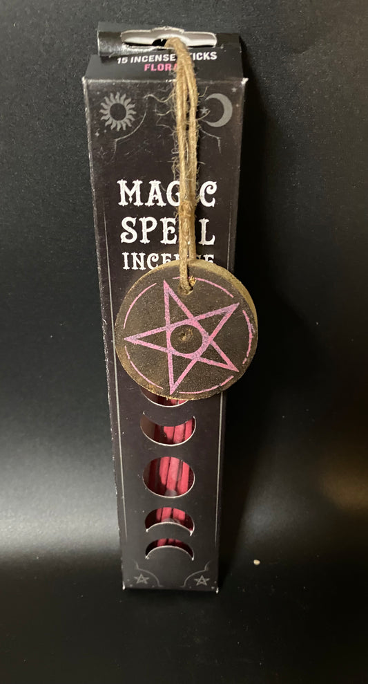 Box of 'Magic Spell' incense sticks with pentagram design on a black background