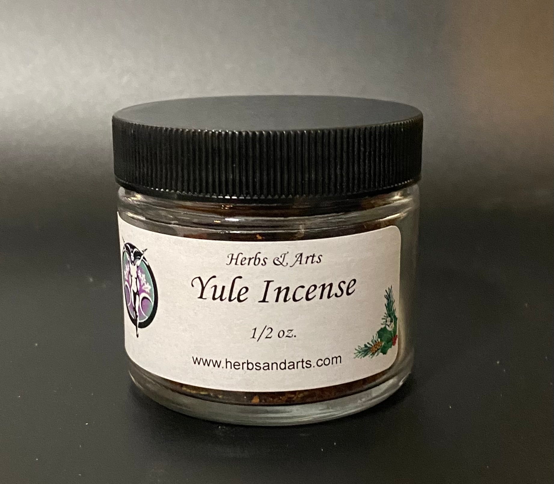 Jar of Yule Incense with a black lid on a gray background