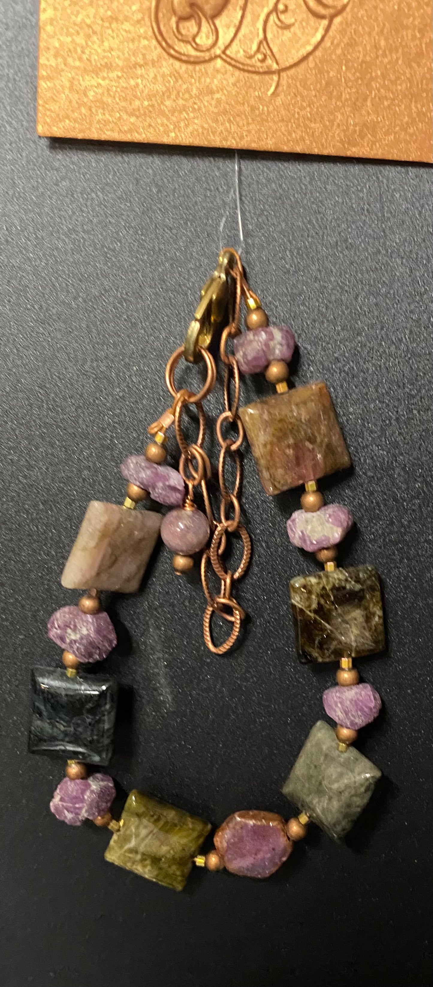 Jewelry with multicolored beads on a dark background