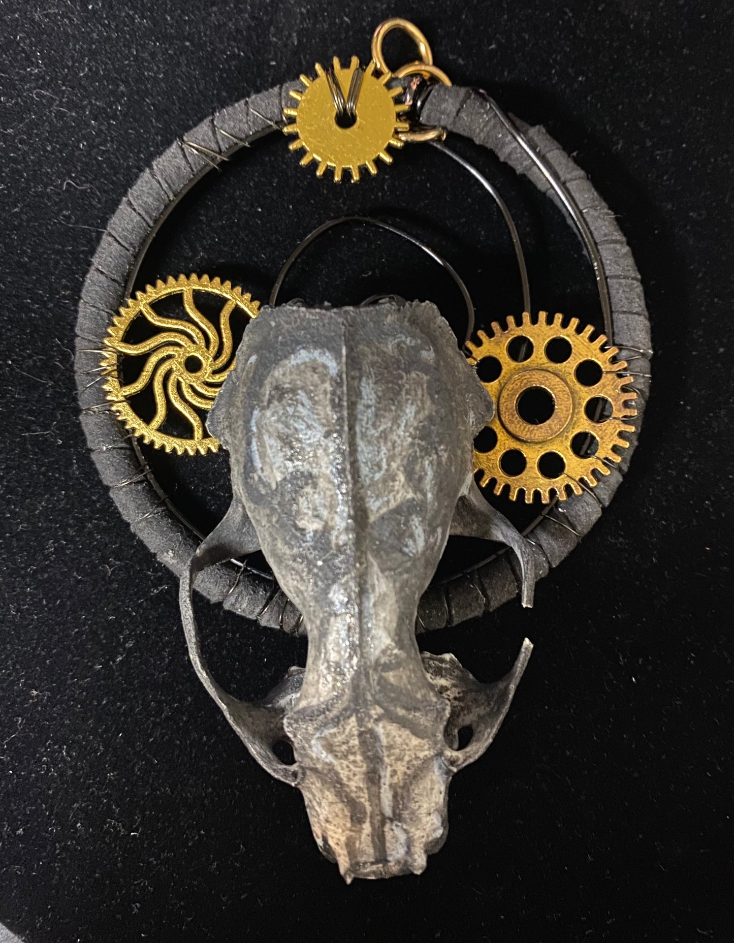 Skull with gold gears on a black background
