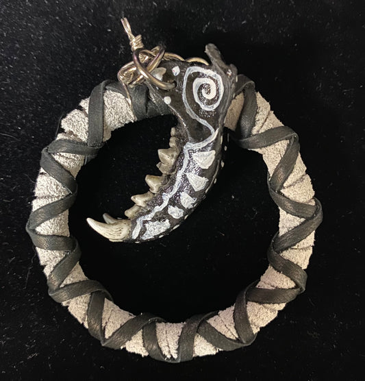 Decorative ring with intricate design on a black background