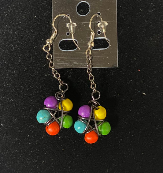 Colorful beaded earrings on a black background