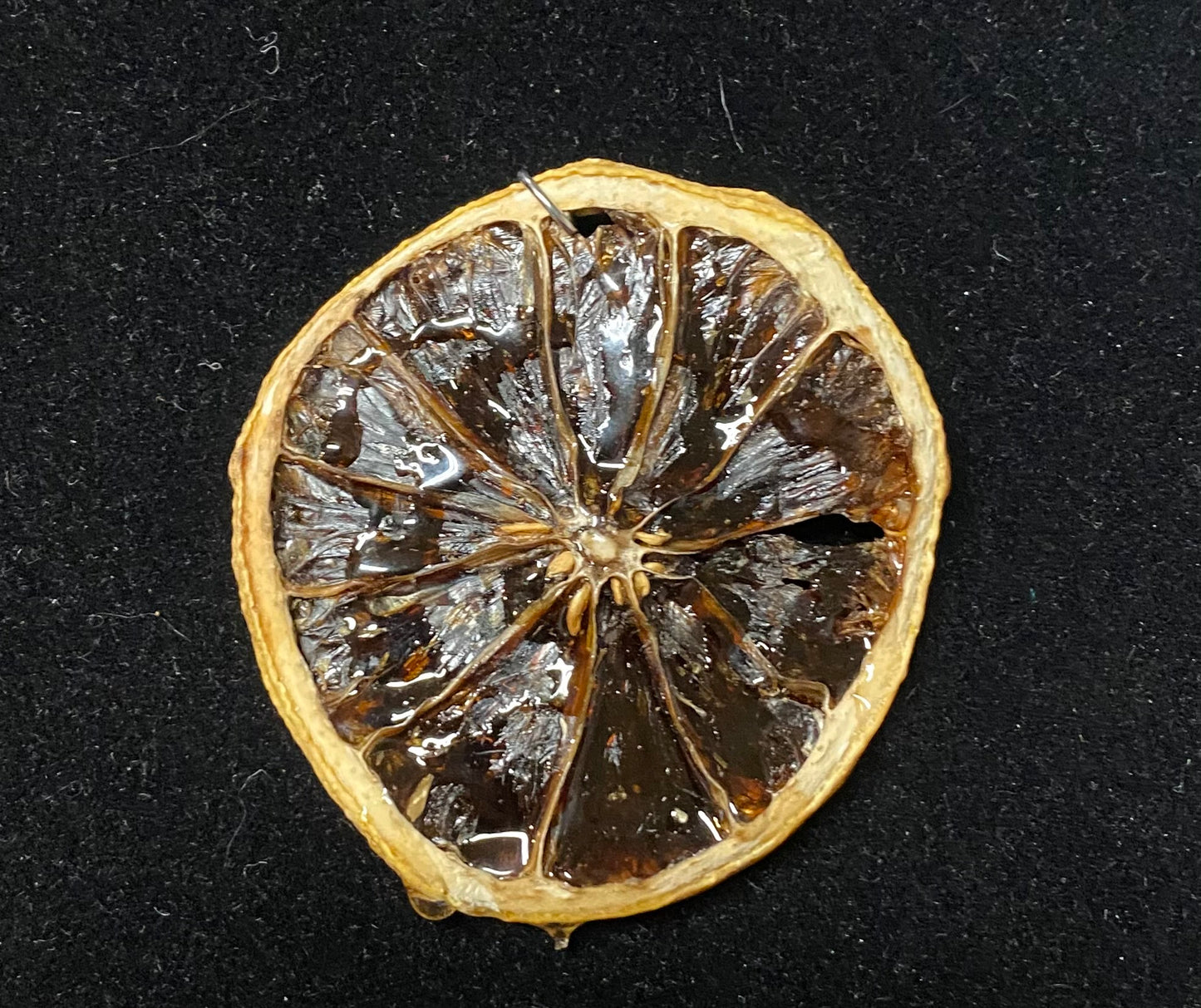 Dried lemon slice on a black background