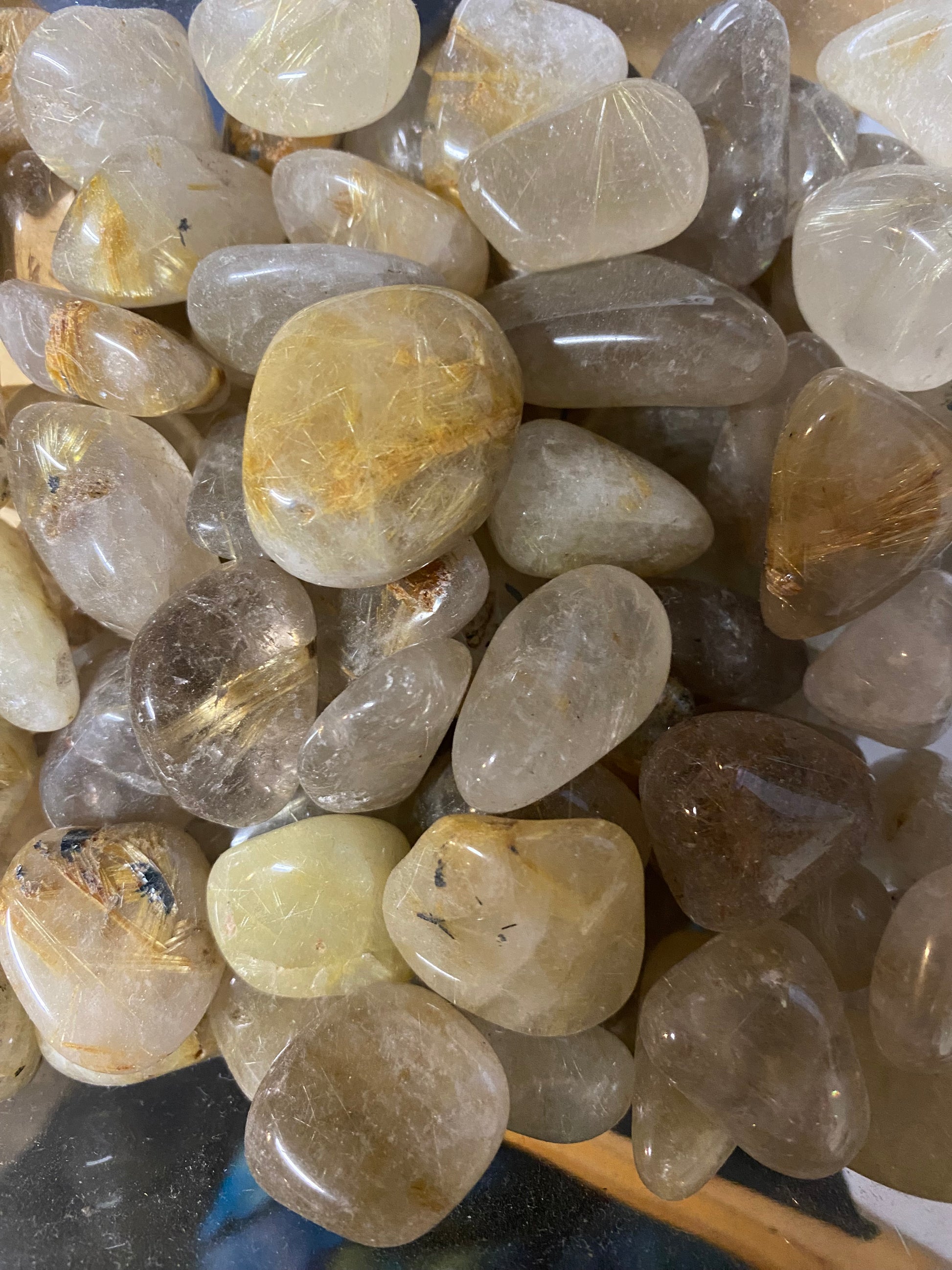 Collection of translucent stones with various colors on a dark background