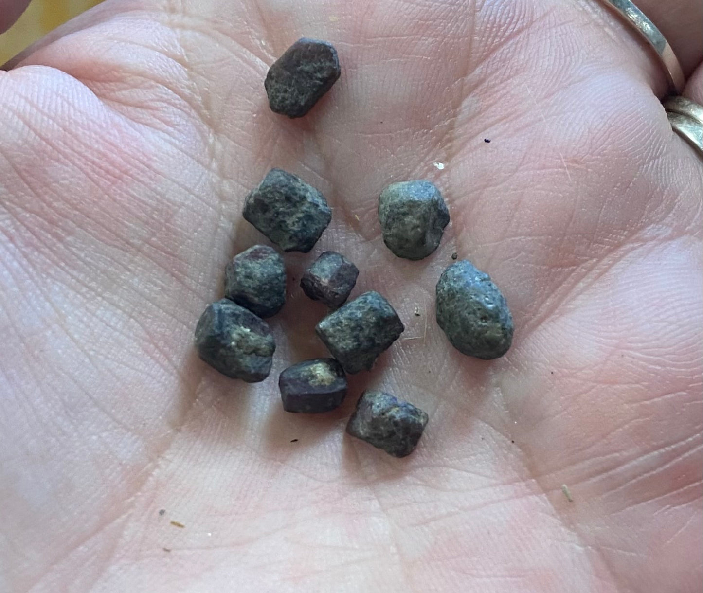 Small rocks on a person's palm