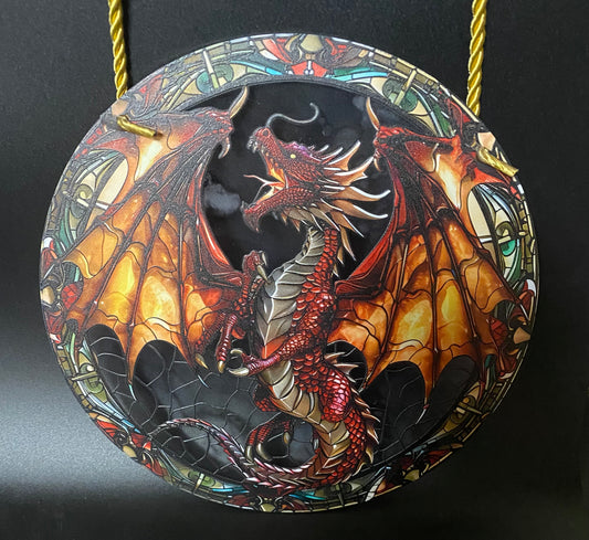 Decorative sun catcher with a dragon design on a black background
