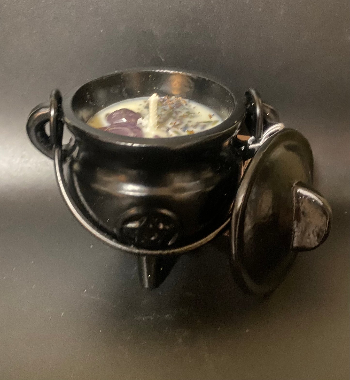 Small iron cauldron with a dark background