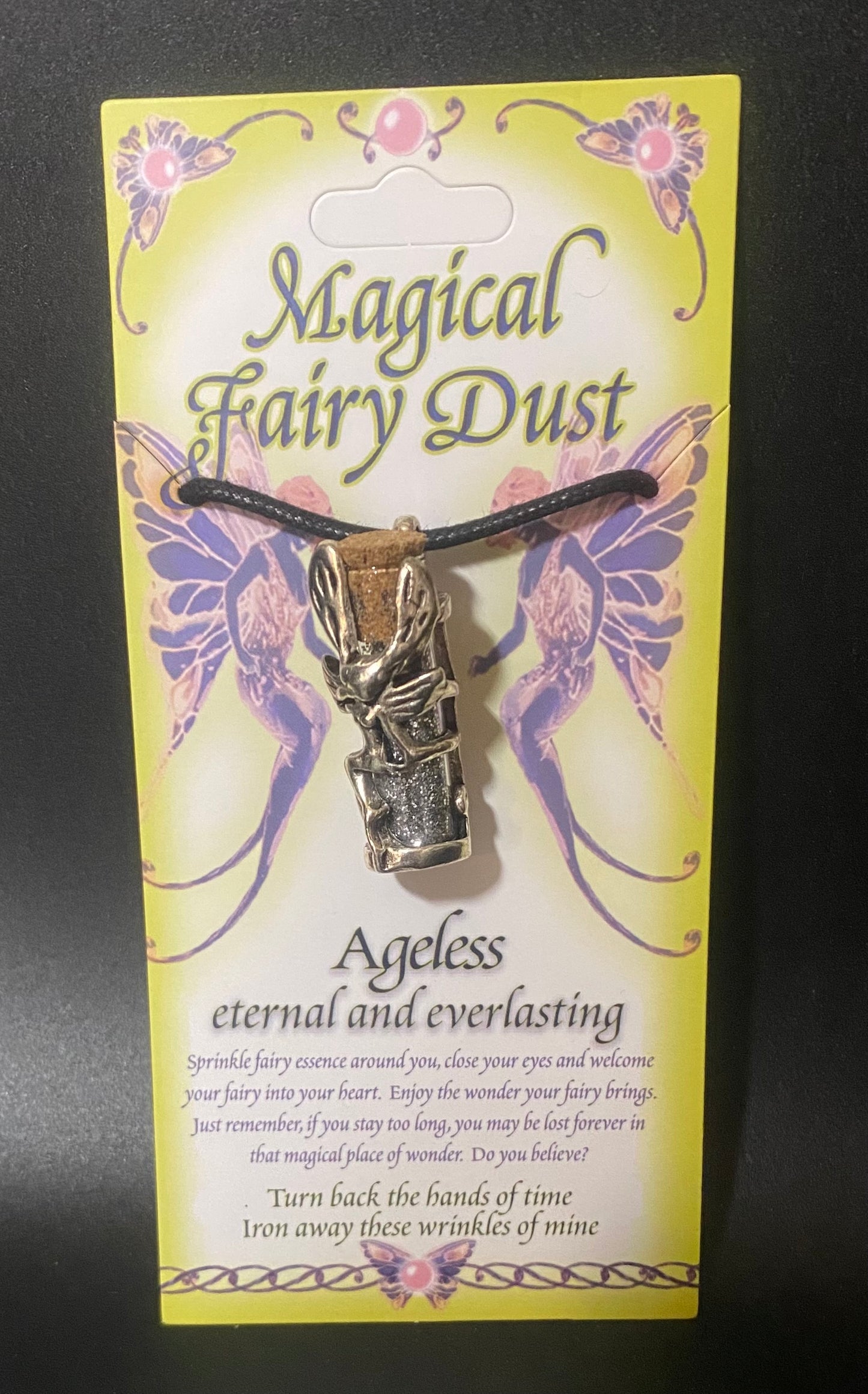 Necklace with fairy pendant on a 'Magical Fairy Dust' card
