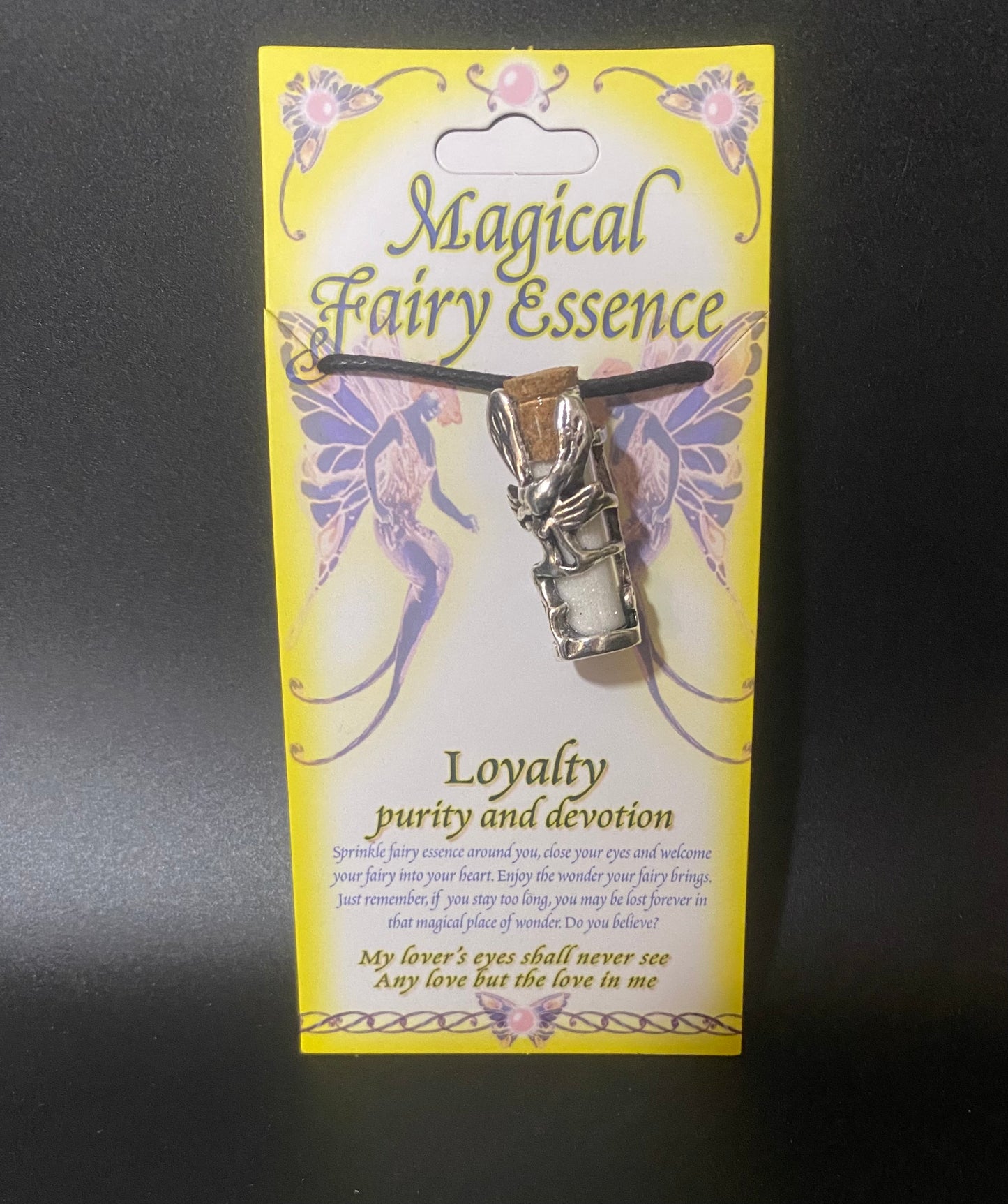 Magical Fairy Essence pendant on a yellow card with fairy designs
