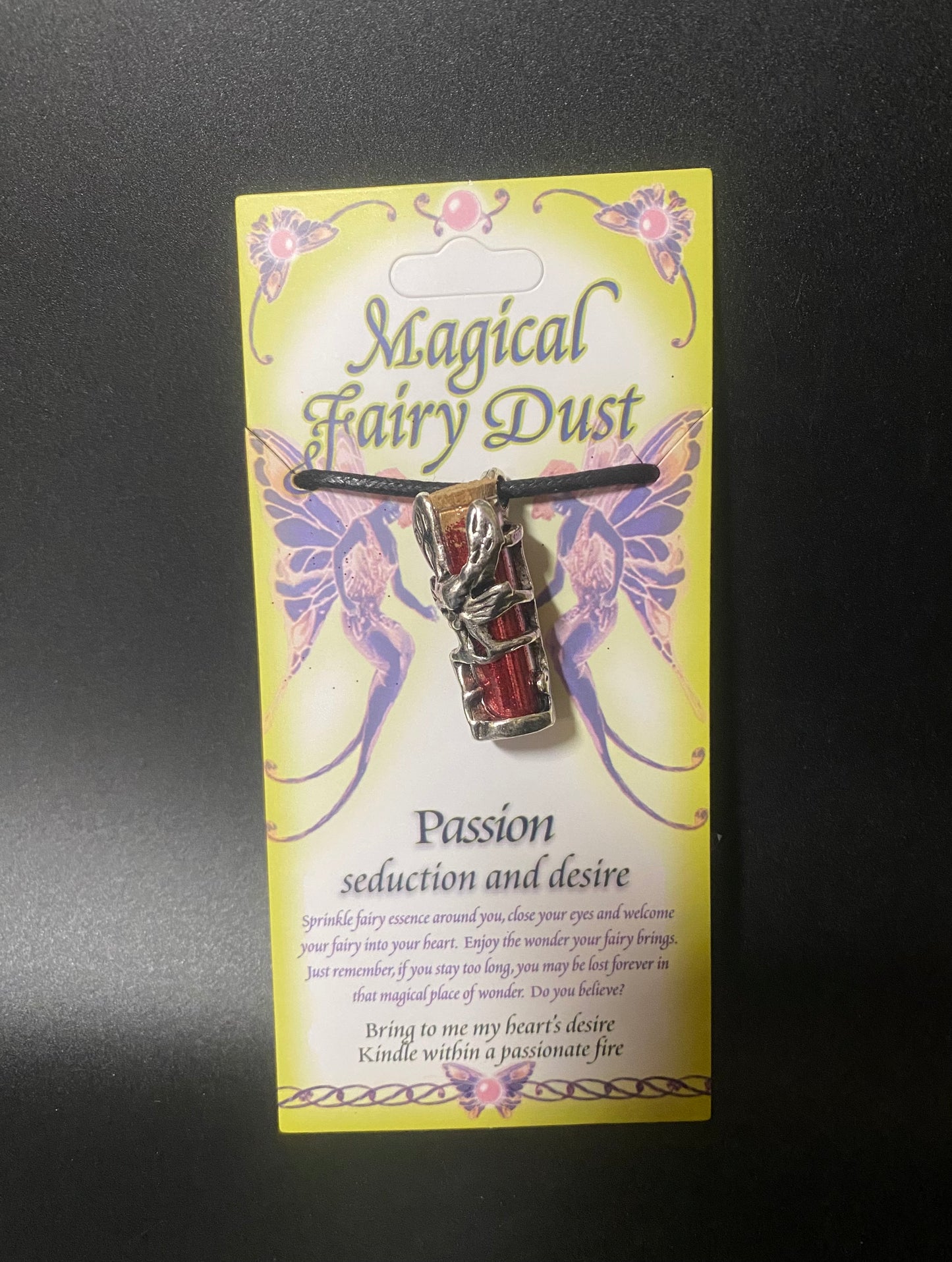 Magical Fairy Dust charm on a card with decorative designs