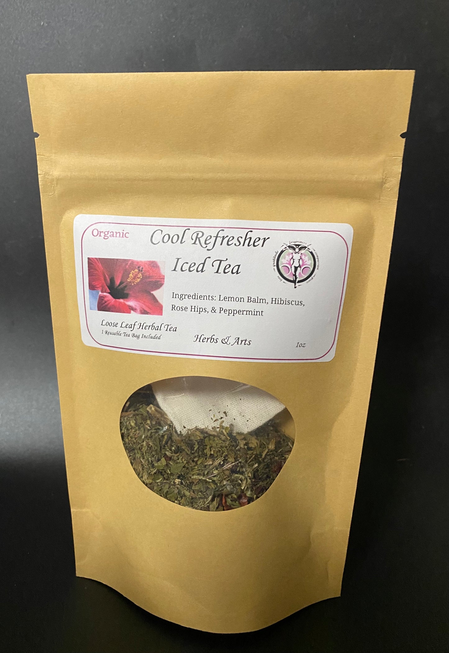 A kraft paper stand-up pouch of 'Cool Refresher Iced Tea' by Herbs & Arts, featuring a white label with a red flower graphic and a circular window showing the dried herbal tea inside.