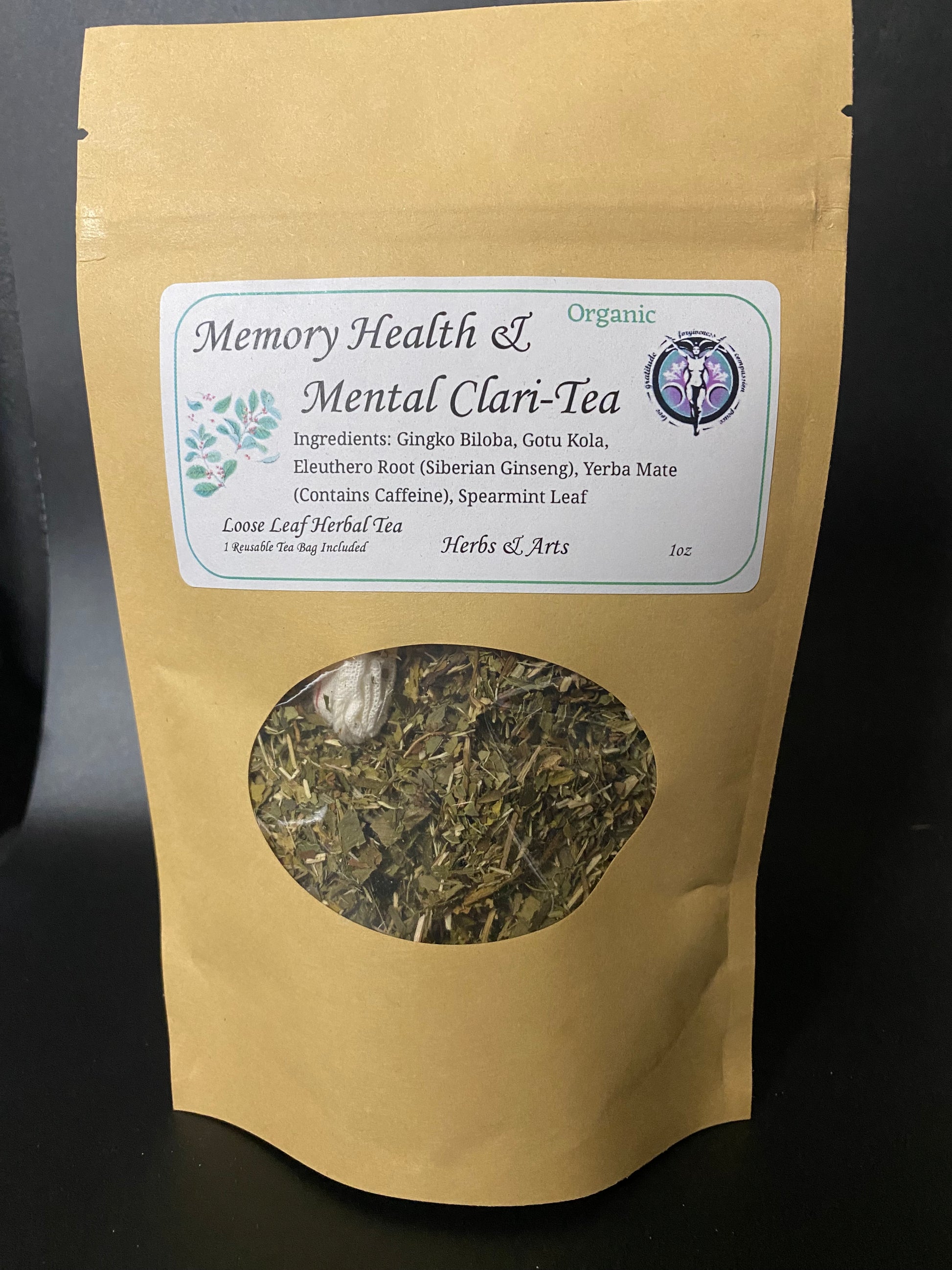 A stand-up kraft paper pouch of Memory Health & Mental Clari-Tea with a white label and a circular window showing loose leaf herbal tea inside, photographed against a dark background.