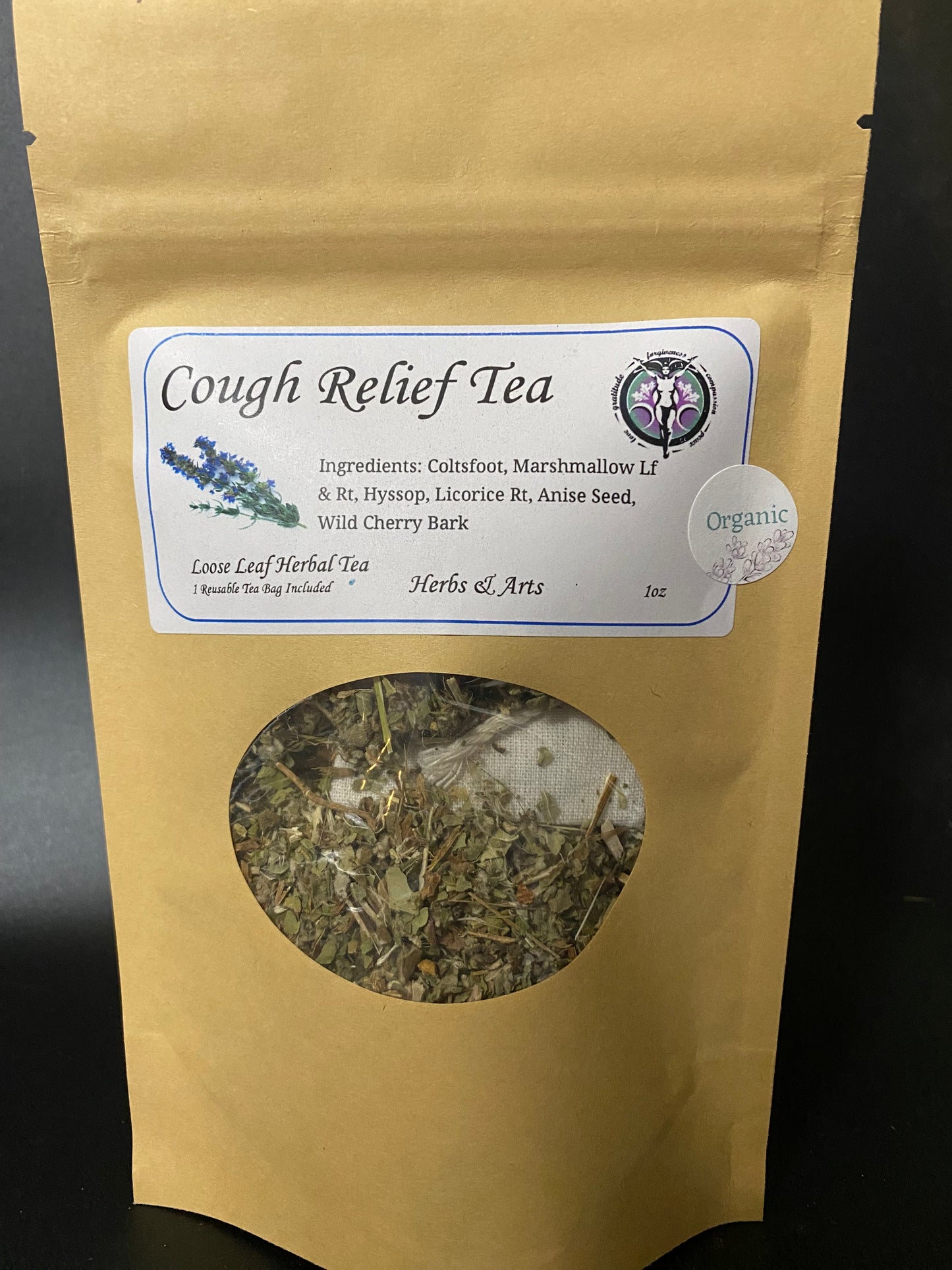 A stand-up kraft paper pouch of Cough Relief Tea with a white product label and a circular clear window showing loose herbal tea inside, photographed against a dark background.