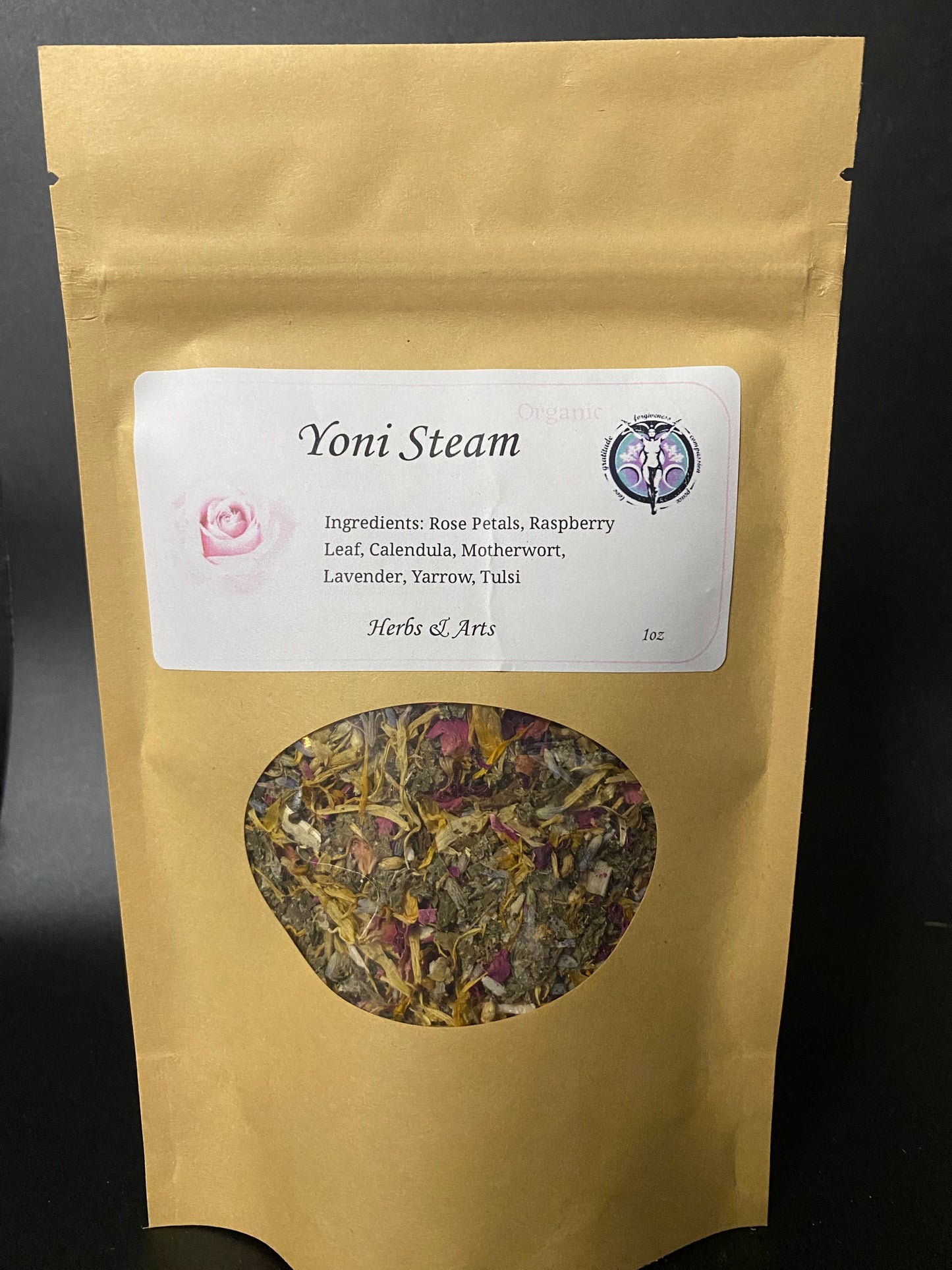 A kraft paper stand-up pouch labeled 'Yoni Steam' with a white product label and a circular window showing dried herbal blend, photographed against a dark background.