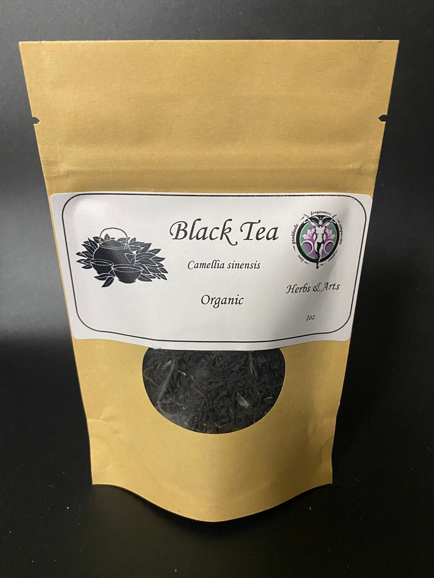 Tea Black Assam T.G.F.O.P. Organic in a Kraft bag with label and window on a black background.