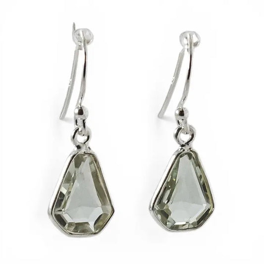 Pair of silver earrings with green teardrop-shaped gemstones on a white background