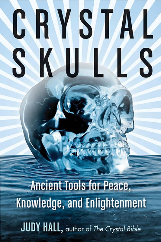 Book cover of 'Crystal Skulls' with a crystal skull and blue background