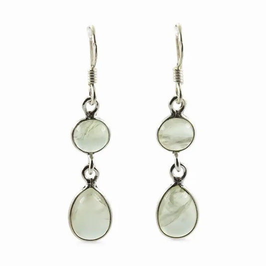 Pair of silver earrings with green gemstones on a white background