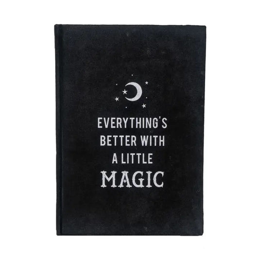 Black notebook with 'Everything's better with a little magic' text and celestial design on a white background
