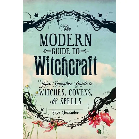 Modern Guide to Witchcraft your complete guide to witches, covens, & spells book cover blue with flowers