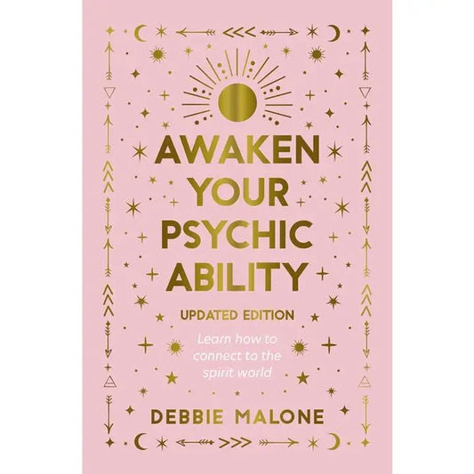 Awaken Your Psychic Ability written in gold on book cover on a pink cover