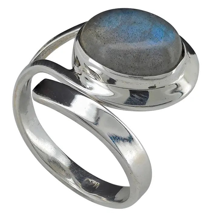 Silver ring with a labradorite stone on a white background