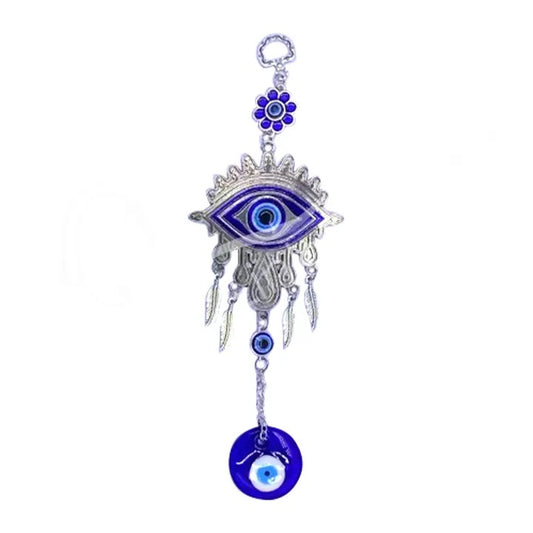Decorative hanging charm with eye design on a white background