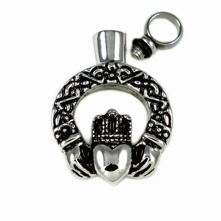 Silver Claddagh pendant on a white background